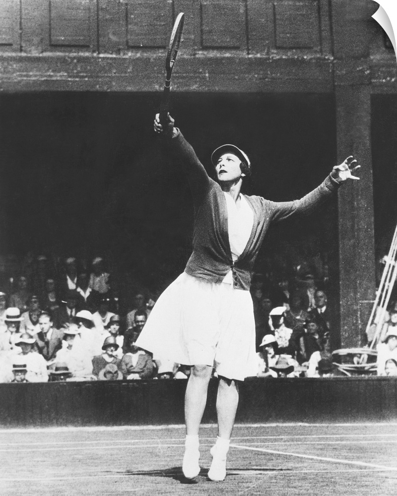 Helen Wills Moody returning a high one during her match with Mrs. J.P. Macready of England. July 4, 1933. Wills Moody won ...