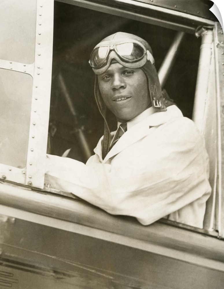 Hubert Julian was the only licensed Black aviator in America. He is in the cockpit of a Bellanca Roma, in his first flying...