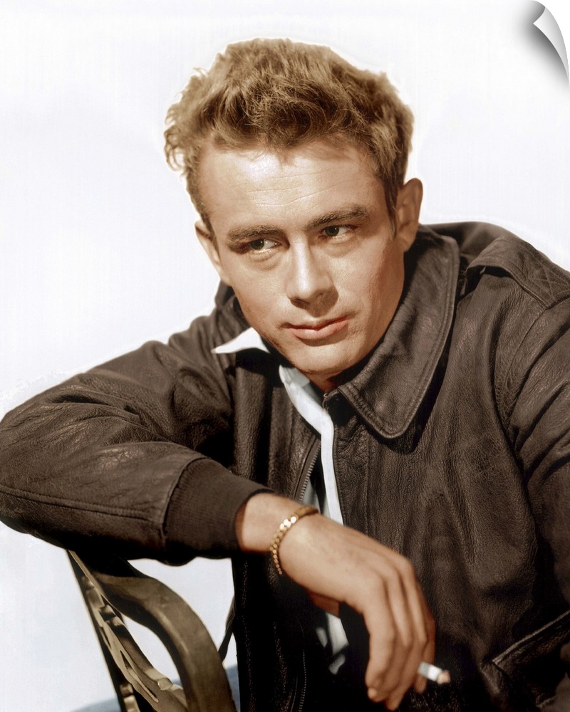 A vintage photograph of the actor James Dean leaning against a chair, to promote his film "Rebel Without a Cause."