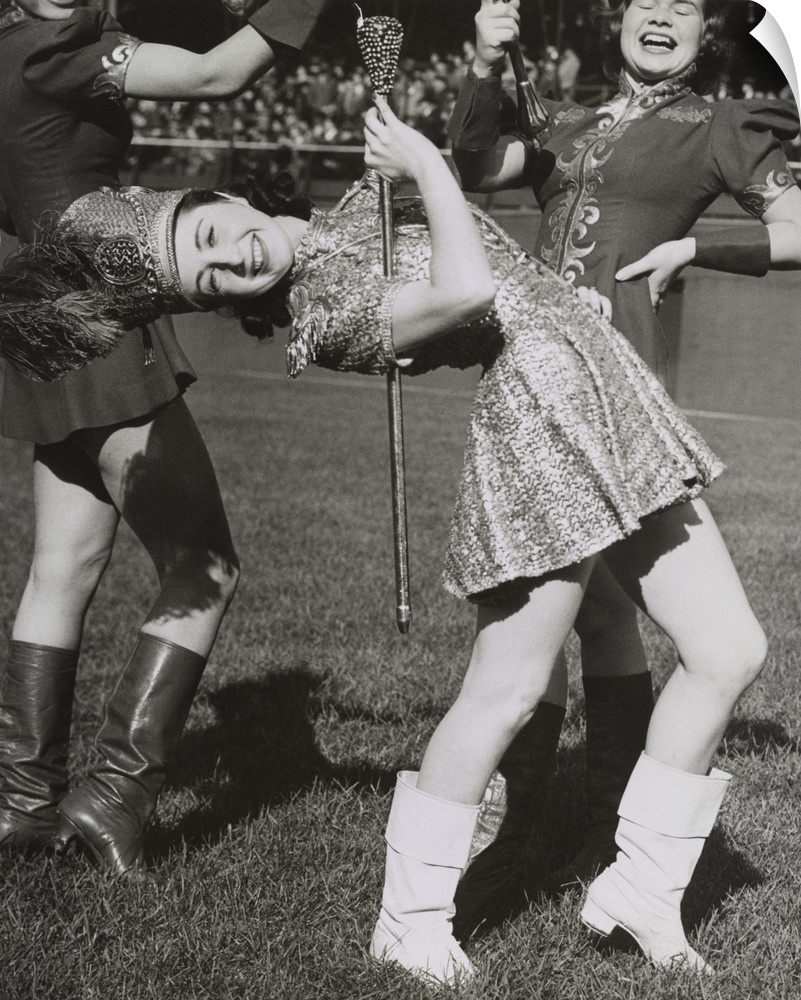 Lead majorette, doing a back bend while holding a baton. Nov. 22, 1939. New York City.