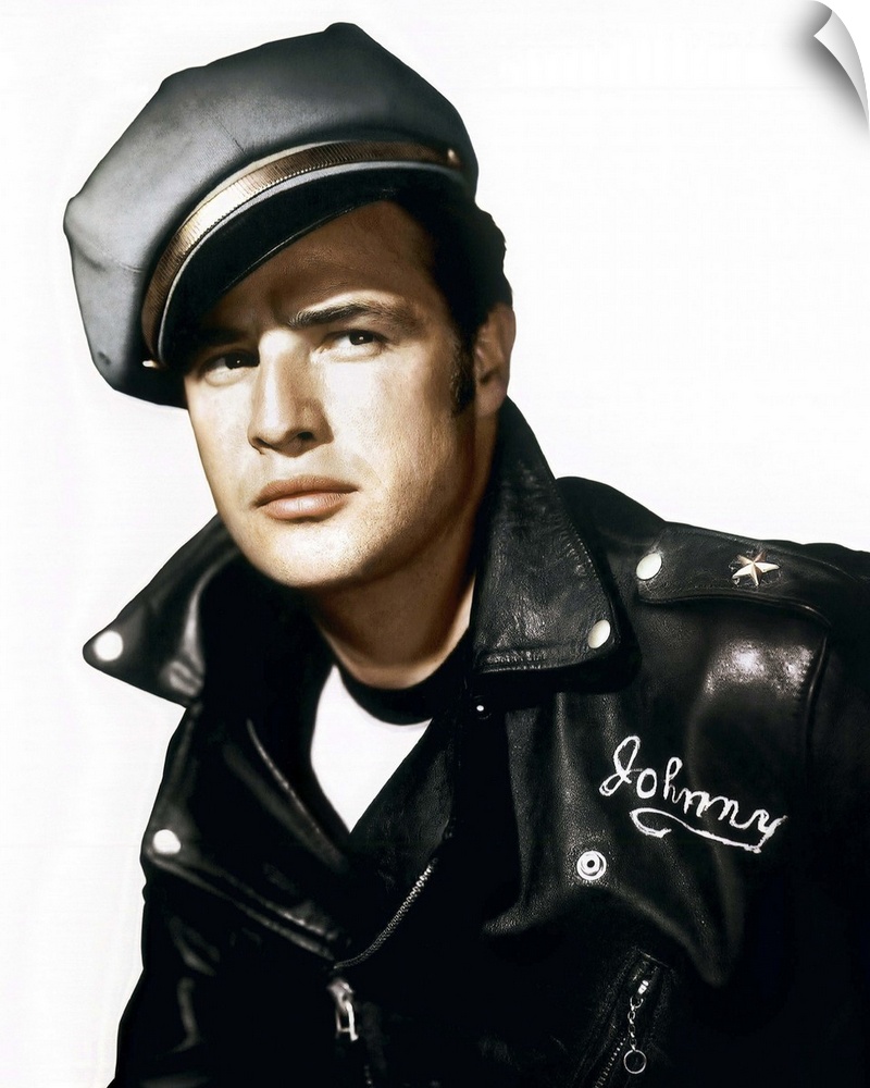 A vintage photograph of Marlon Brando wearing a leather jacket and cap, to promote his movie "The Wild One."