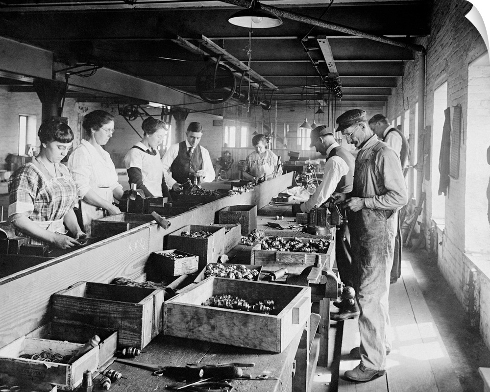 Men and Women working on an assembly line in the Express Spark Plug Co. Ca. 1920, in the Washington, D.C. area.