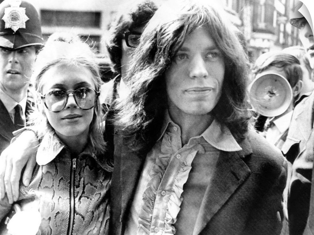 Mick Jagger and his girl friend, singer Marianne Faithful arrive at Magistrate's Court. The couple faced charges of posses...
