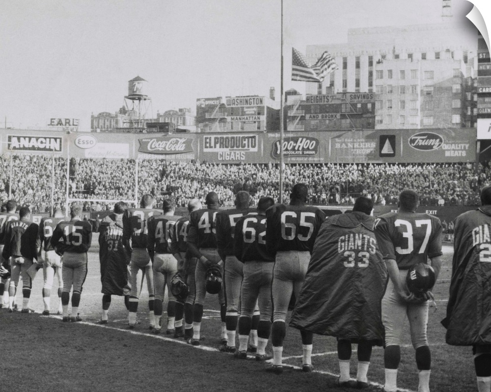 New York Giants football team during a moment of prayer for President John Kennedy. Nov. 24, 1963. The game was well atten...