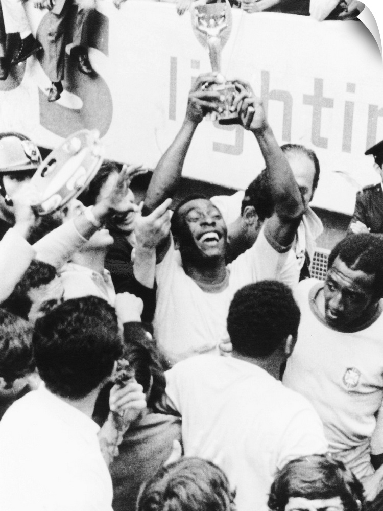 Pele in triumph in Mexico City, June 21, 1970. He holds up the Jules Rimet Cup, won by Brazil for defeating Italy 4-1 in t...