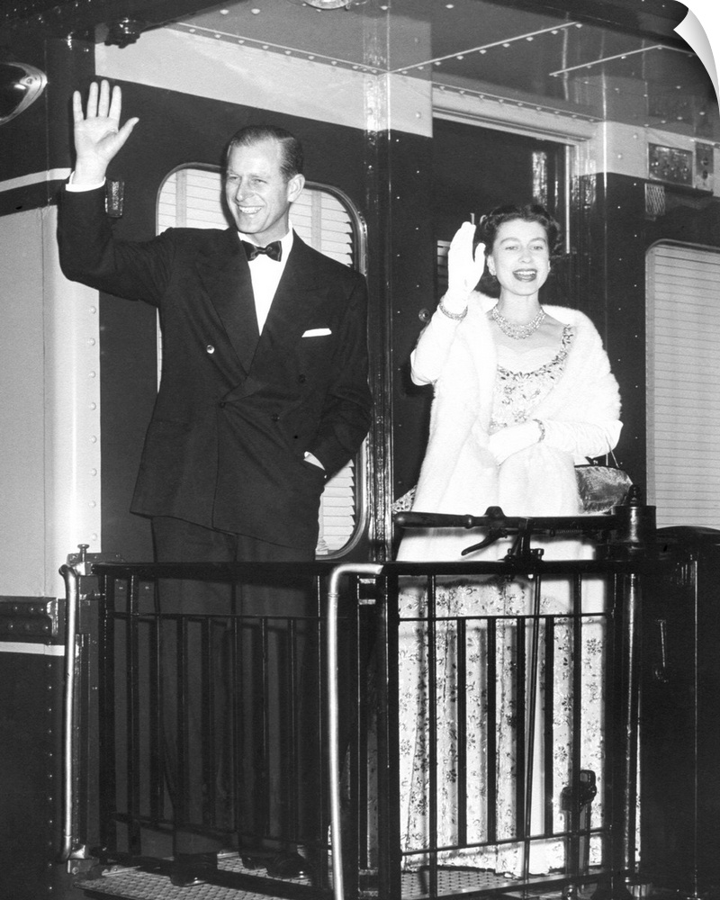 Queen Elizabeth II and Prince Philip wave from the back of a train at Union Station. After entertaining the President Eise...