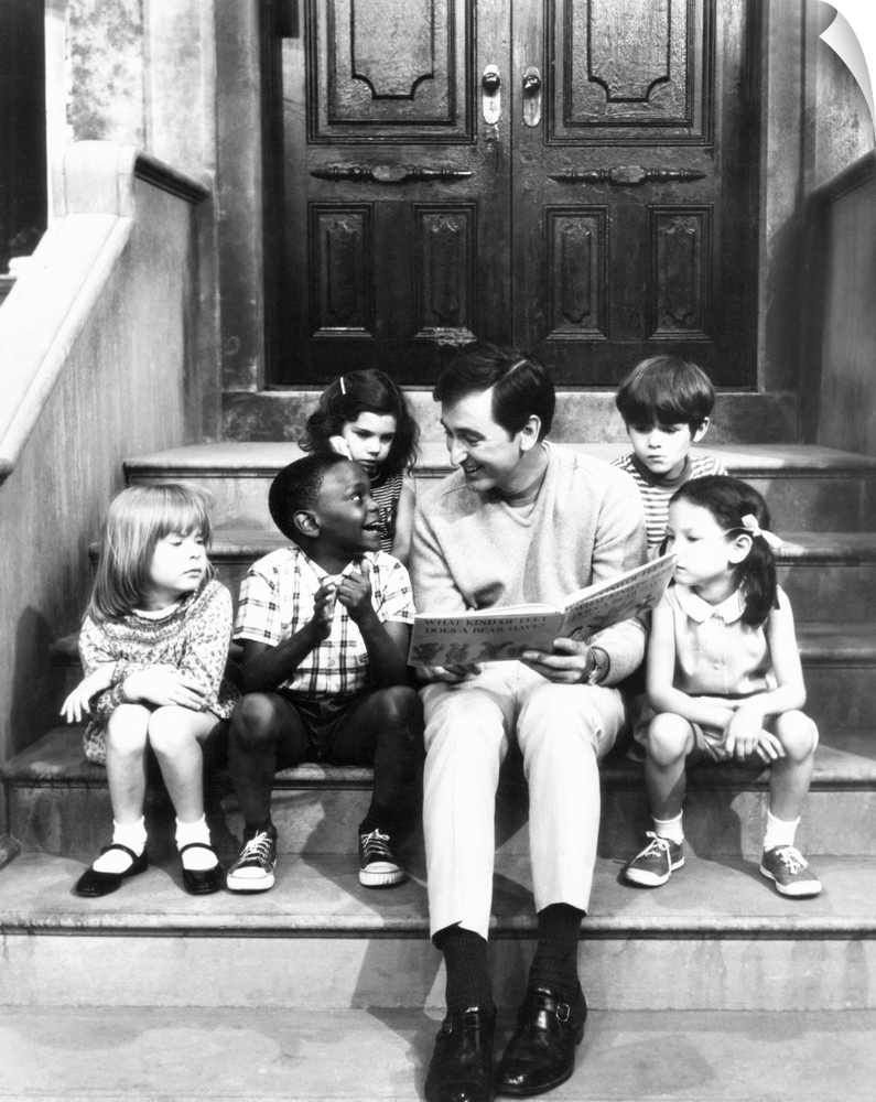 Robert Emmet McGrath, as character Bob Johnson, reading to children on Sesame Street, 1970.