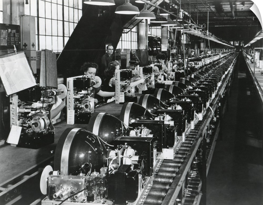 Television chassis on an assembly line with women workers in a U.S. factory. July 1949.