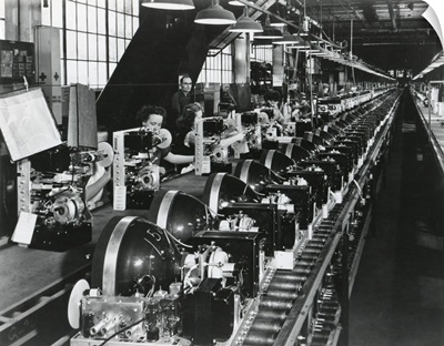 Television chassis on an assembly line with women workers in a US factory, July 1949