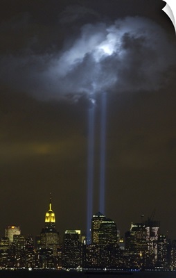Tribute in Light Memorial illuminates a passing cloud above lower Manhattan