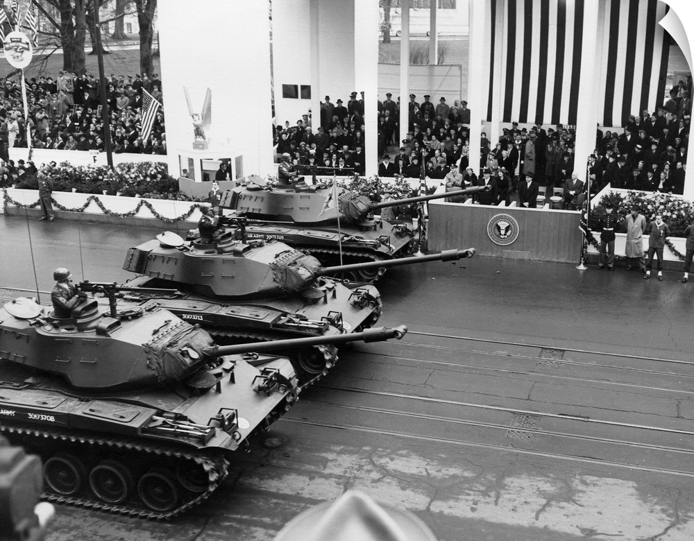 U.S. Army tanks pass Eisenhower's reviewing stand during the Inaugural parade. Jan 21, 1957.