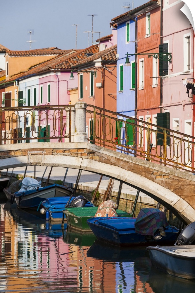 Italy, Burano. Reflection of colorful houses in canal.