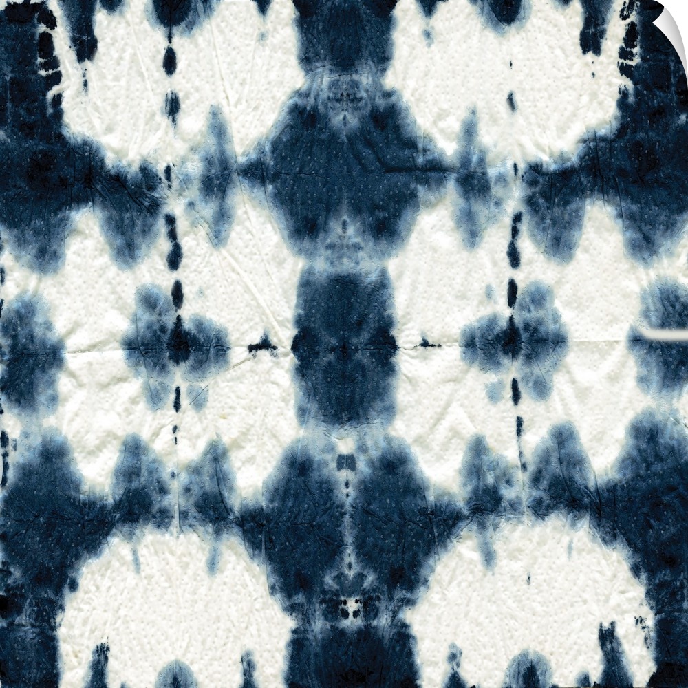 Square shibori art with a pattern in indigo and white.