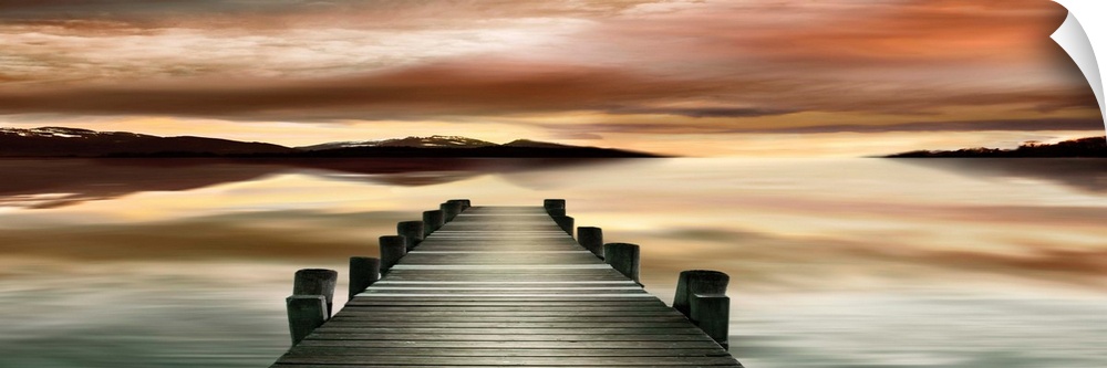 Photograph of a wooden dock with a dream-like sunset.