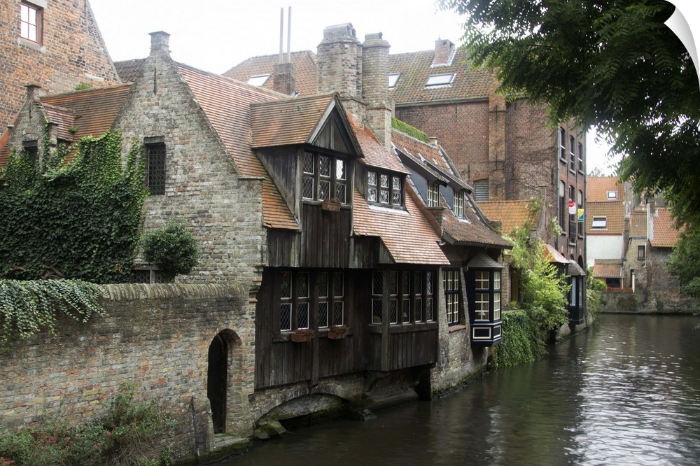 Photograph of old houses on the edge of the river in Belgium.