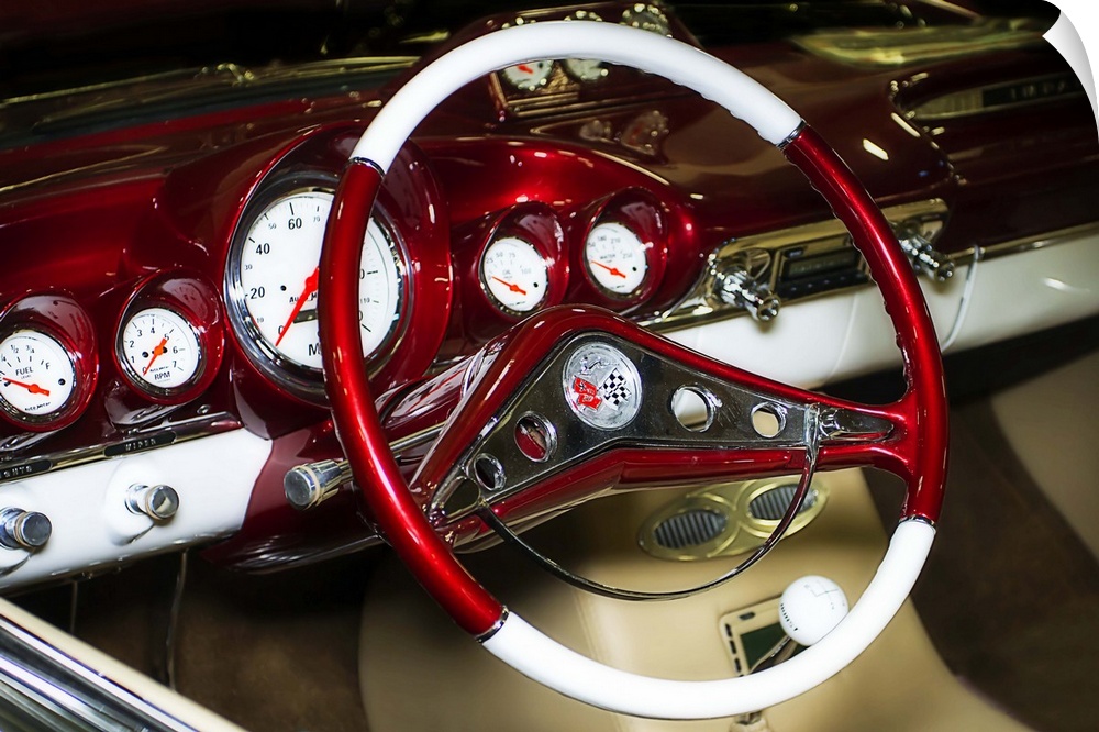 Fine art photograph of the retro steering wheel and dashboard of a vintage car.