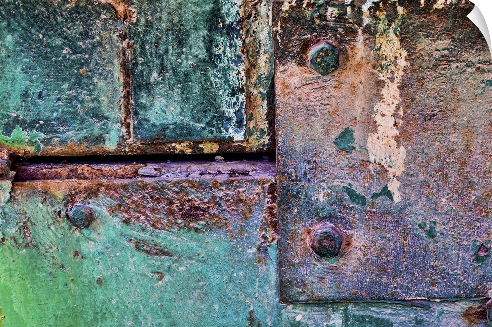 A close up photo of weathered metal elements, creating an abstract image.