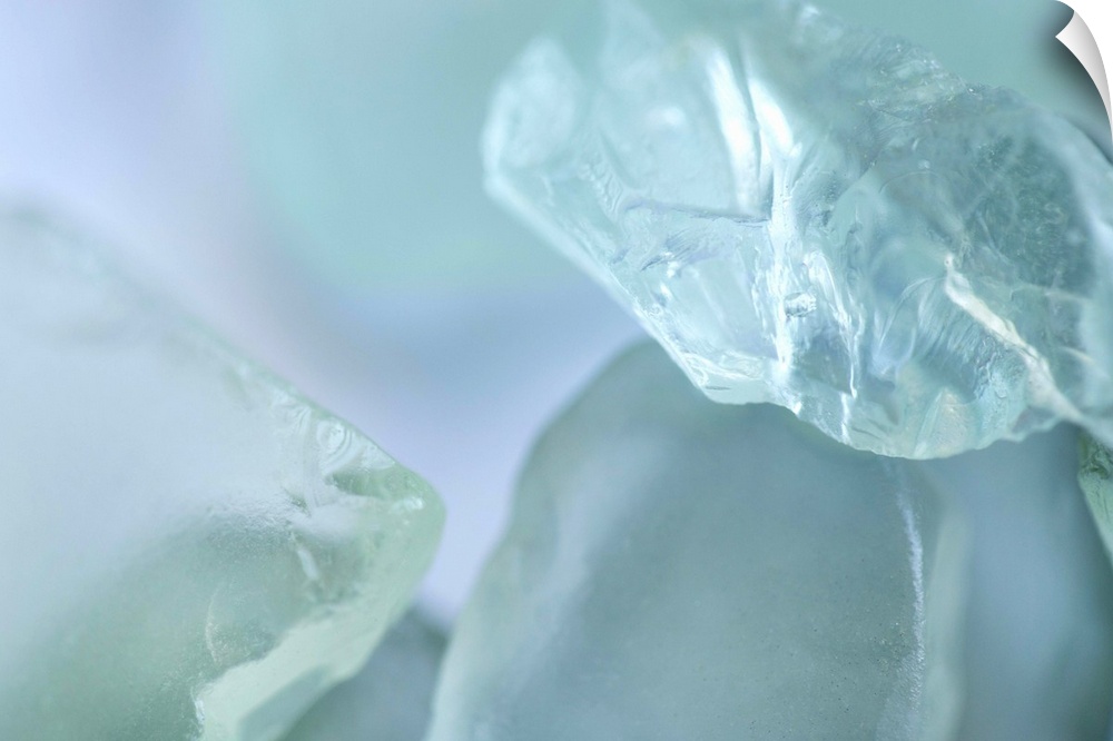 Close up of light blue pieces of glass.