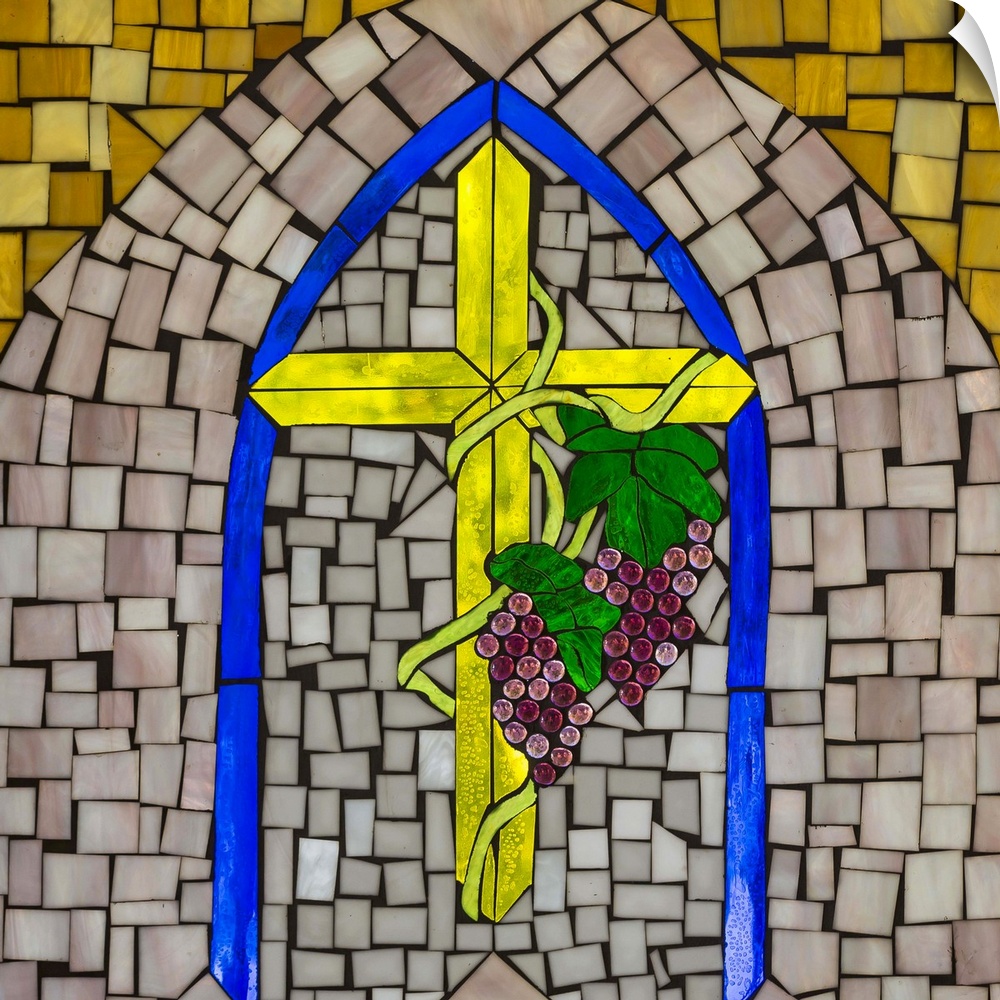 Artwork done in a stained-glass style depicting a cross and wine grapes, symbols of Christianity.