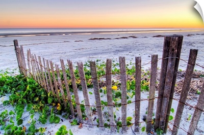 A beach fence at sunset on Hilton Head Island, South Carolina.