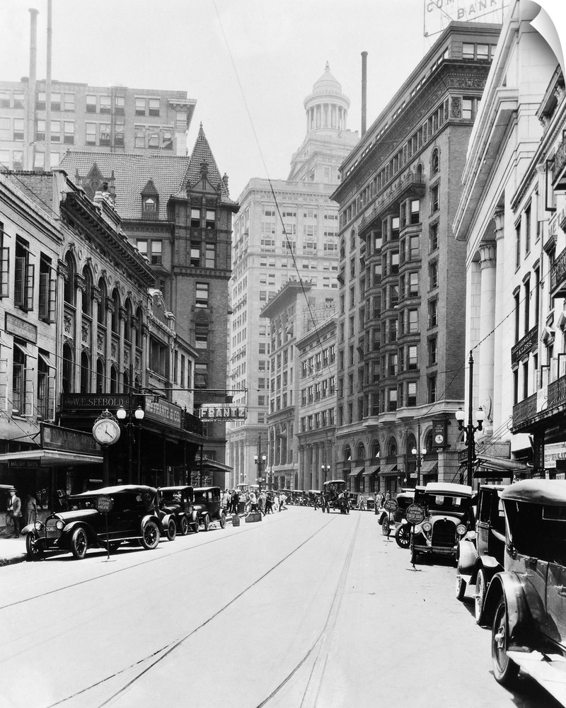 Carondelet Street looking south. On the right; the Federal Reserve Bank, the Maritime Building, the Marine Building, the N...
