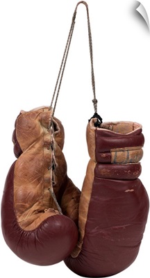 A pair of brown leather boxing gloves