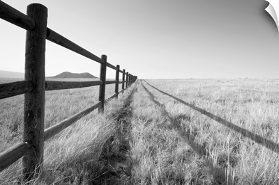 A split rail fence vanishing into the horizon. Aspen, Colorado