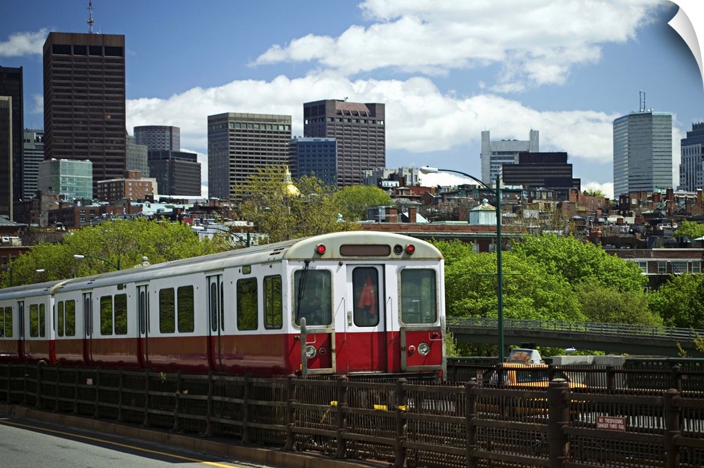 A train with Boston skyline background