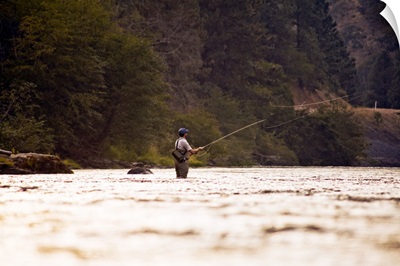 A young man fly fishing on the Klickitat River.
