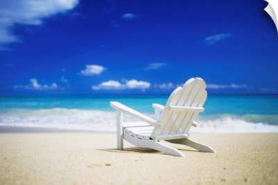 Adirondack chair sitting on a beach in Honolulu, Hawaii