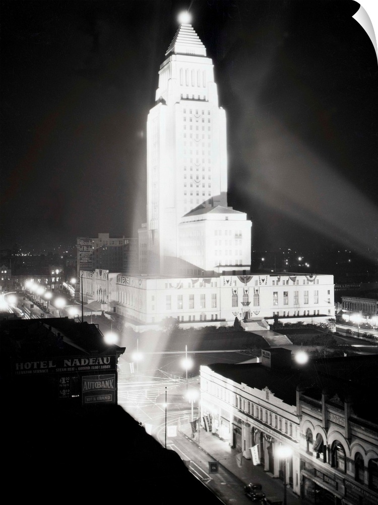 1930-Los Angeles, California: Aerial view of City Hall, at night.