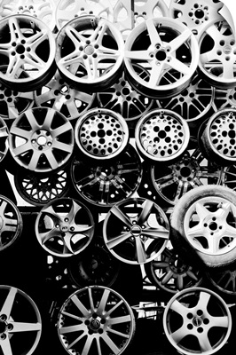 Aluminium and steel car wheels at auto repair shop.