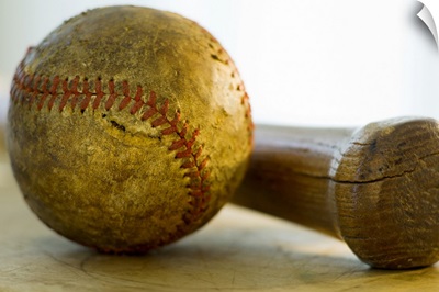 Antique baseball with baseball bat