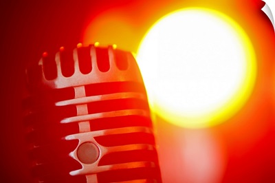 Antique microphone in spotlight