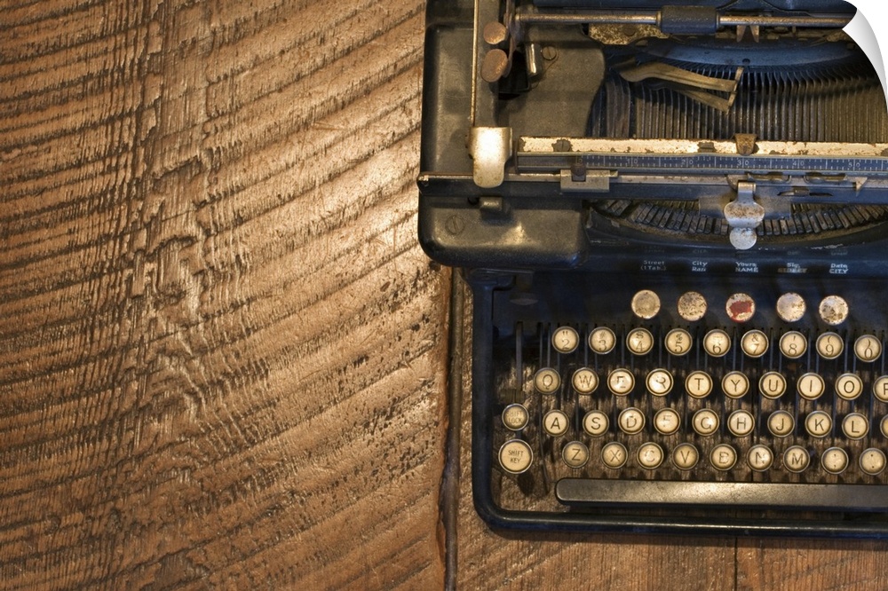 Antique typewriter on wooden surface