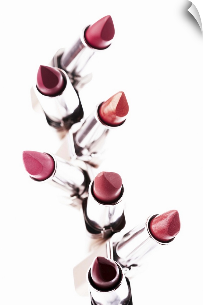 Assortment of coloured lipsticks, close-up, elevated view