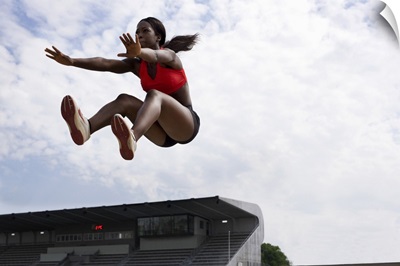 Athlete in midair during long jump