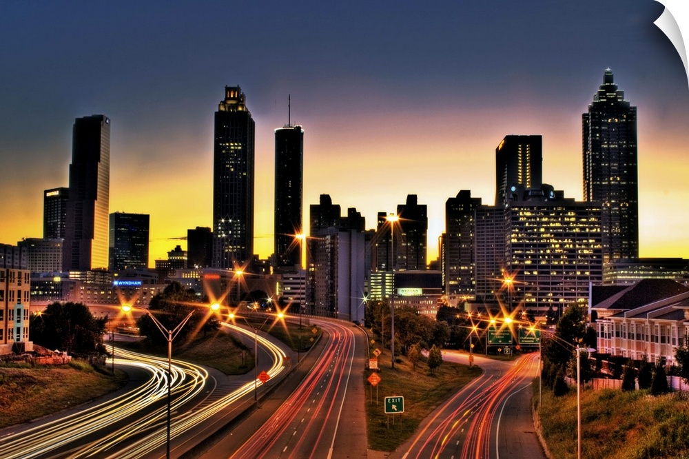 Atlanta colorful skyline with sun setting in background.