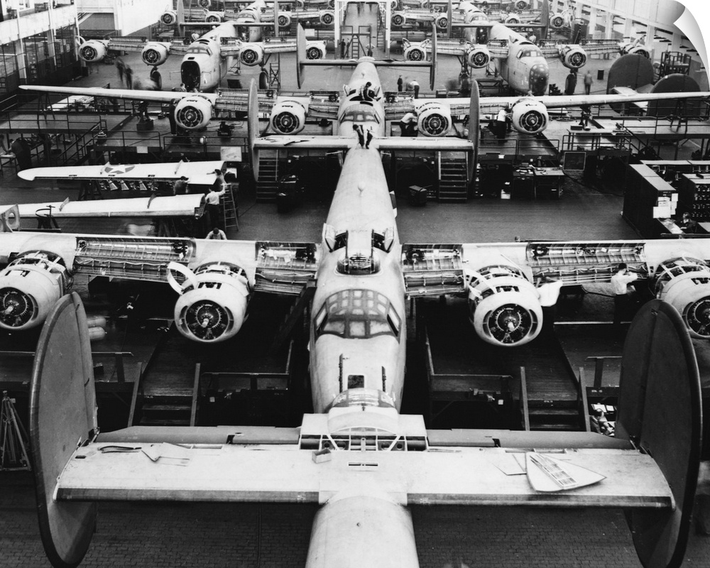 B-24 bombers under construction at a plant in Michigan during World War II. | Location: Willow Run, Michigan, USA.