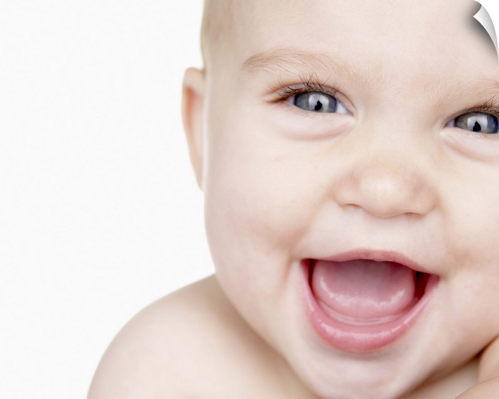 Baby boy (6-9 months) laughing, close up, portrait, studio shot