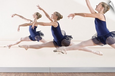Ballerinas leaping in midair
