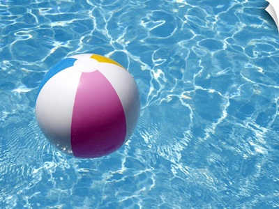 Beach ball in swimming pool the picture of summer holidays.