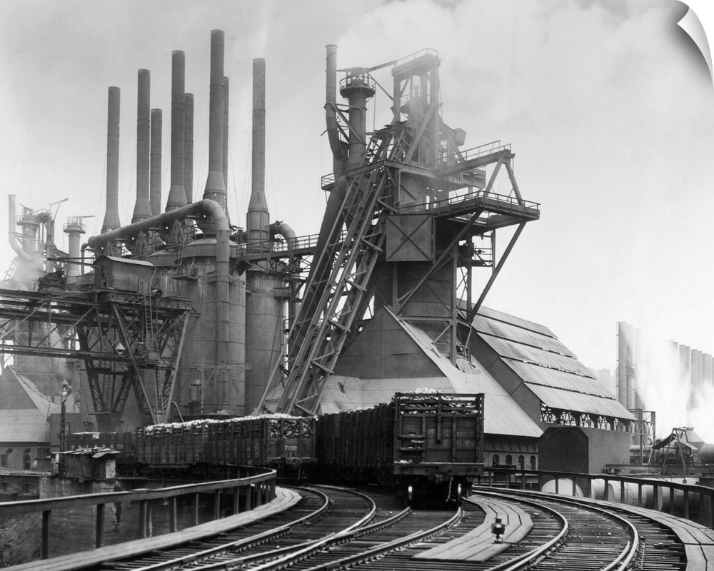 Pittsburgh, PA. Blast furnaces of the Carnegie Steel Corp. Photograph shows an exterior of Steel Plant with smokestakes an...