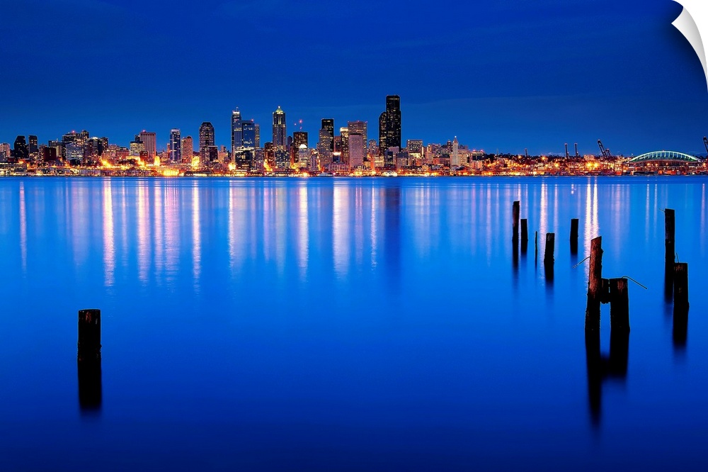 Blue hour view of downtown Seattle across Elliott bay, from nearby Alki in West Seattle.
