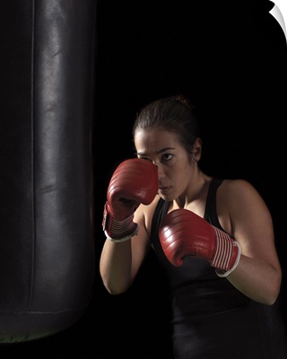 Boxer training on punching bag
