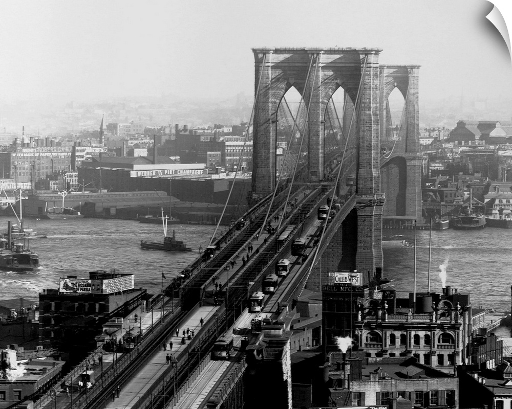 A walkway, train track and carriage drive span the Brooklyn Bridge, the largest suspension bridge at the time of its compl...