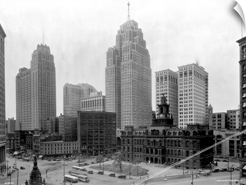 The Guardian Building (tall tower on l) and the Penobscot Building (tall tower on r) tower over a public square in the hea...