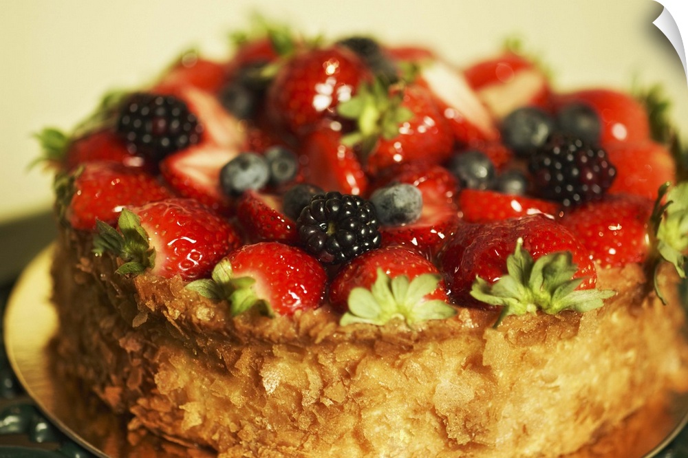 Cake topped with variety of berries