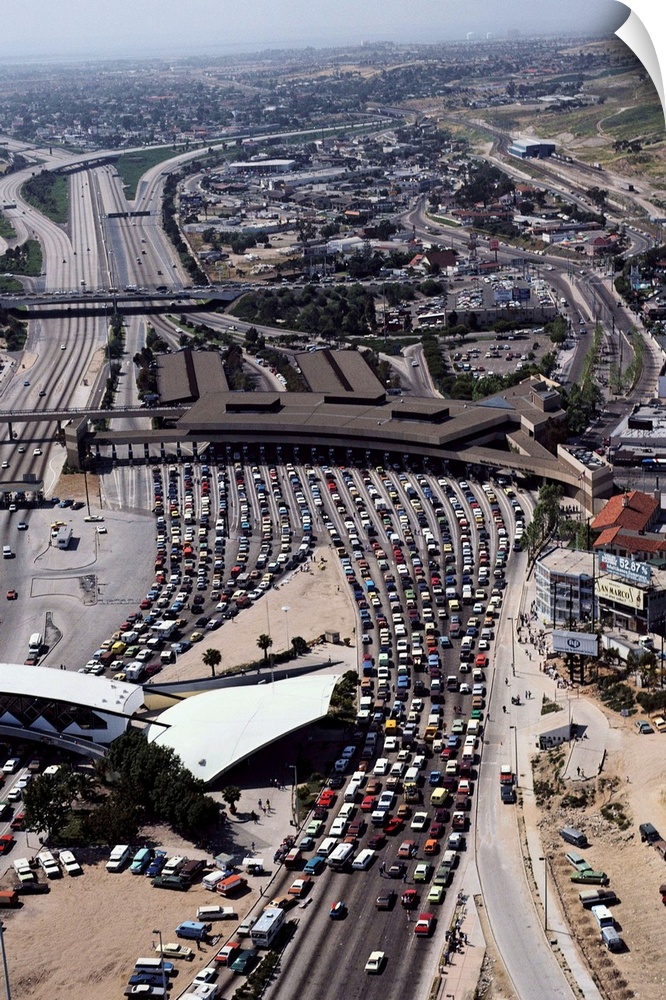 Cars line up at the border inspection station at San Ysidro, California, to cross between the United States and Baja Calif...