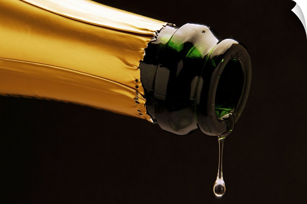 Champagne drop dripping from bottle, close-up